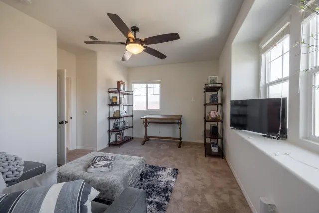 a spacious bathroom with a granite countertop sink and a mirror