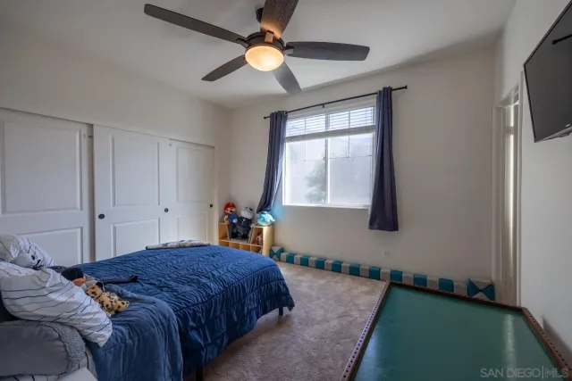 a front view of a house with a garden and plants