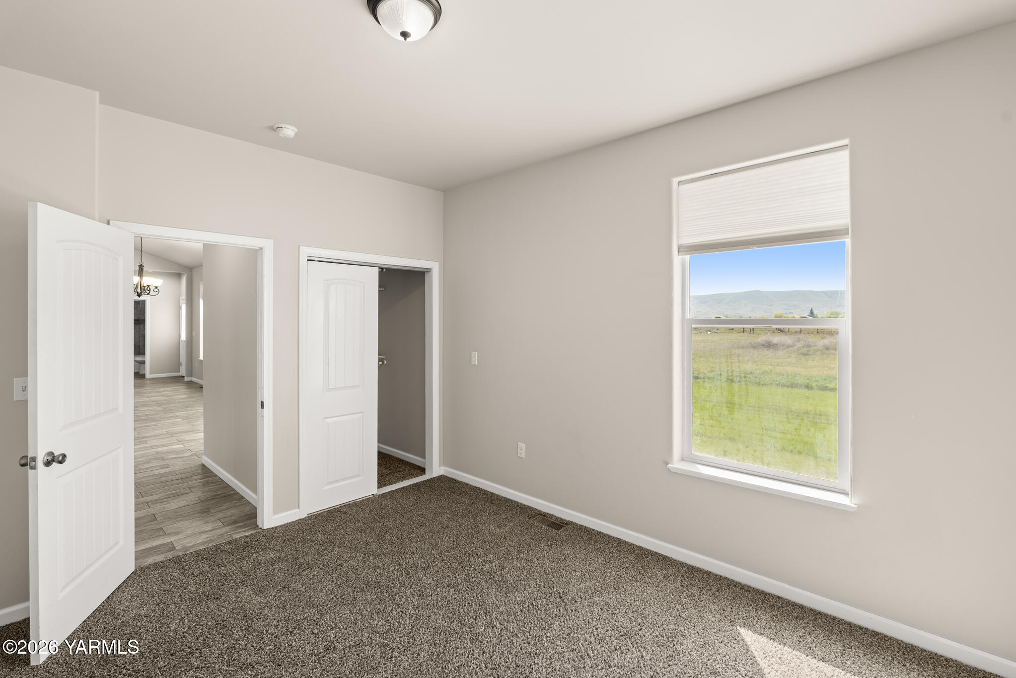 11625 Missimer Road Prosser, WA 99350 - Photo 29 of 40 a view of an empty room with closet and a window
