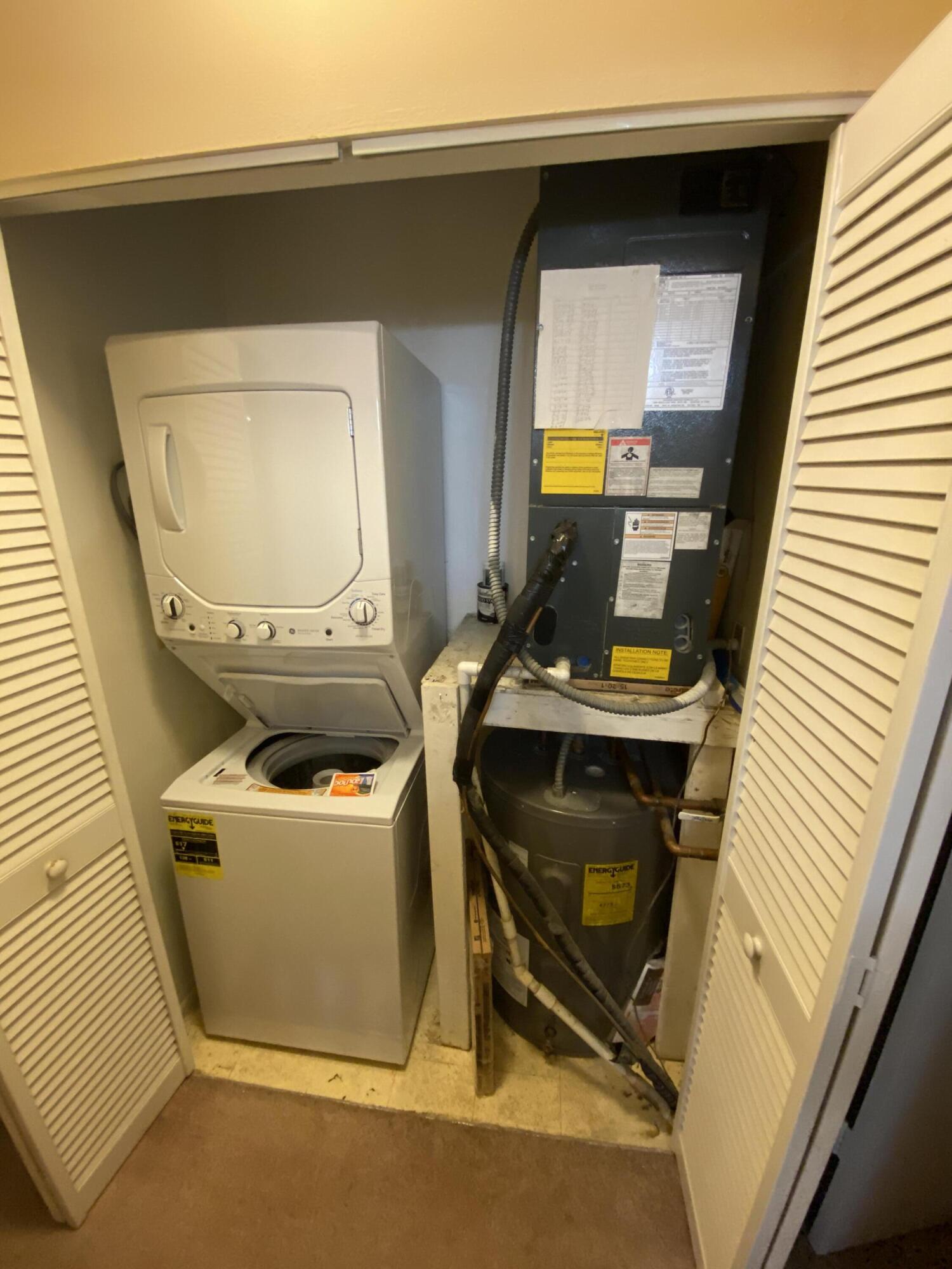 6032 Indrio Road, Unit 4 Fort Pierce, FL 34951 - Photo 14 of 26 Utility closet, NEW washer/dryer