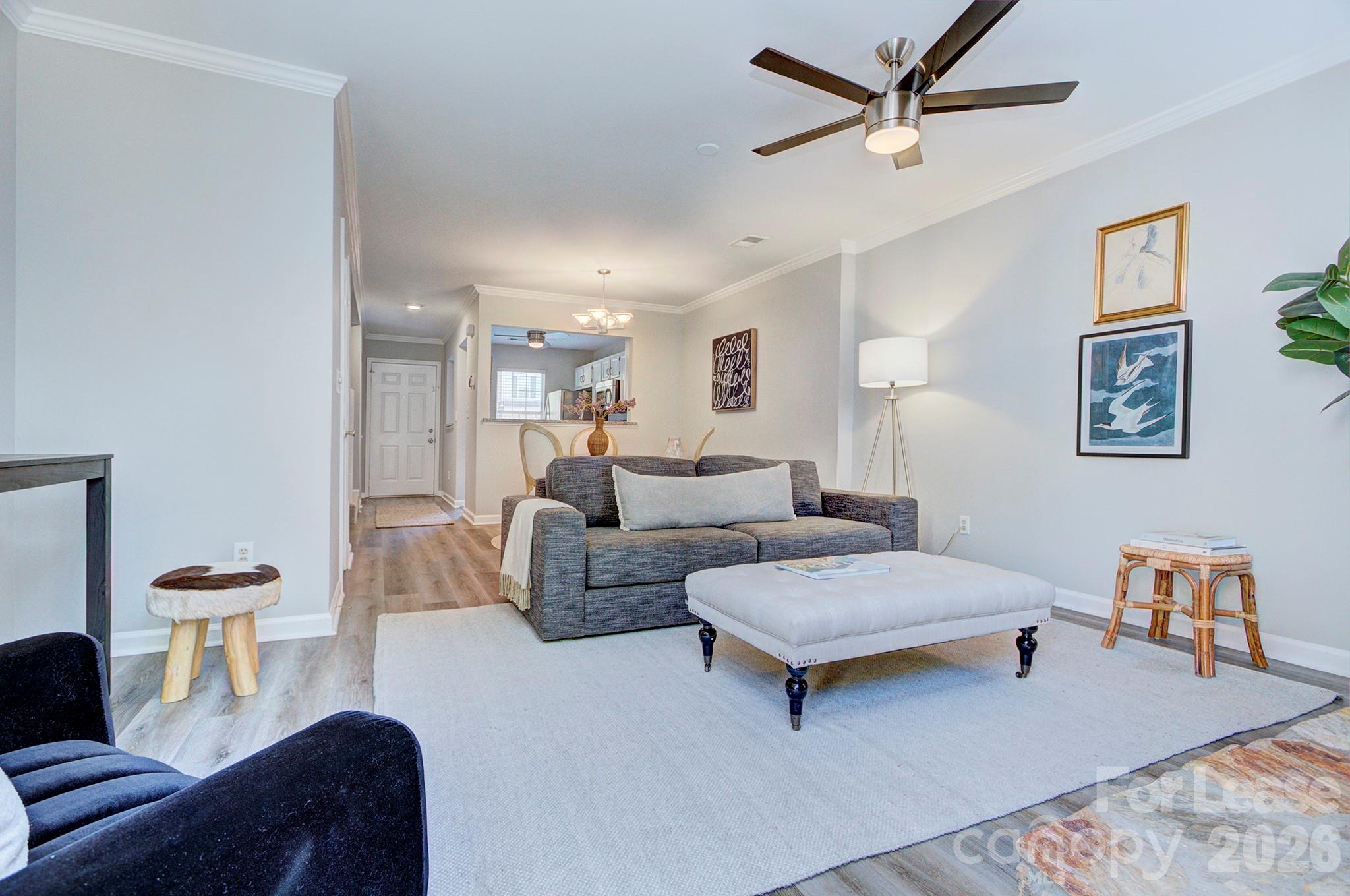 8268 Golf Ridge Drive Charlotte, NC 28277 - Photo 13 of 24 a living room with furniture and a wooden floor