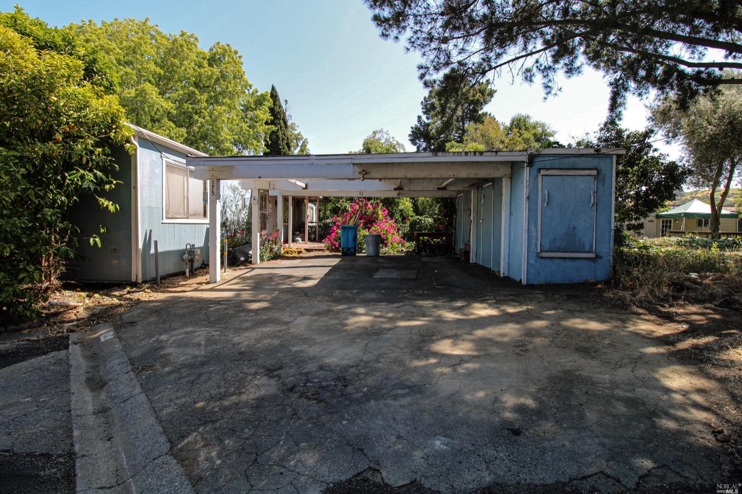 a view of a car park in front of house