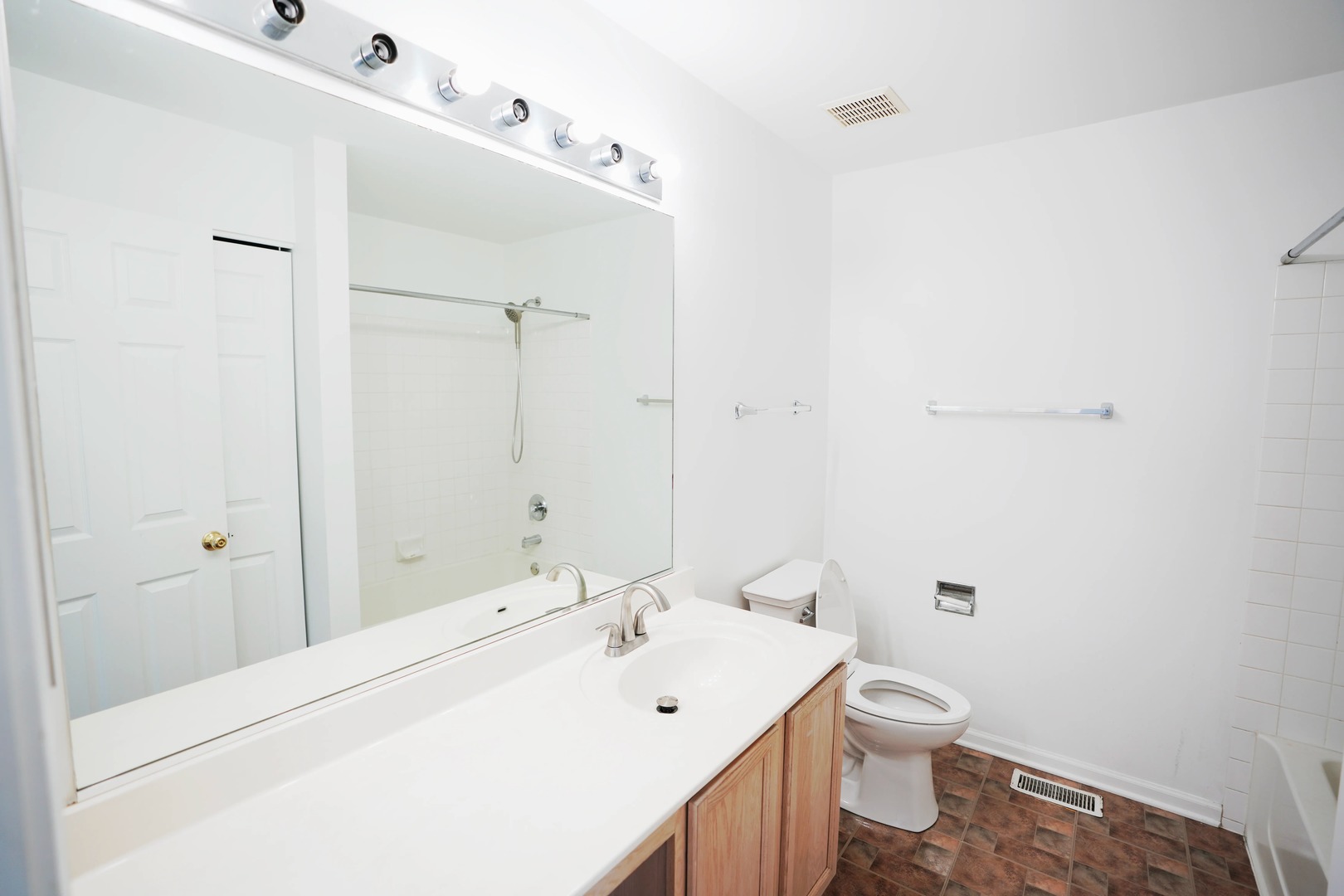 2441 Oneida Lane, Unit 2441 Naperville, IL 60563 - Photo 13 of 21 a bathroom with a sink a toilet and shower