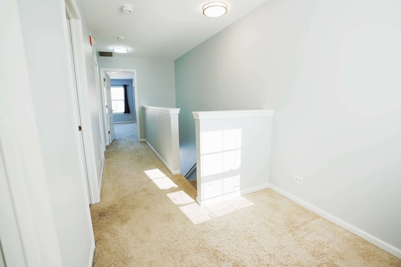 2441 Oneida Lane, Unit 2441 Naperville, IL 60563 - Photo 19 of 21 a view of a hallway with a white walls