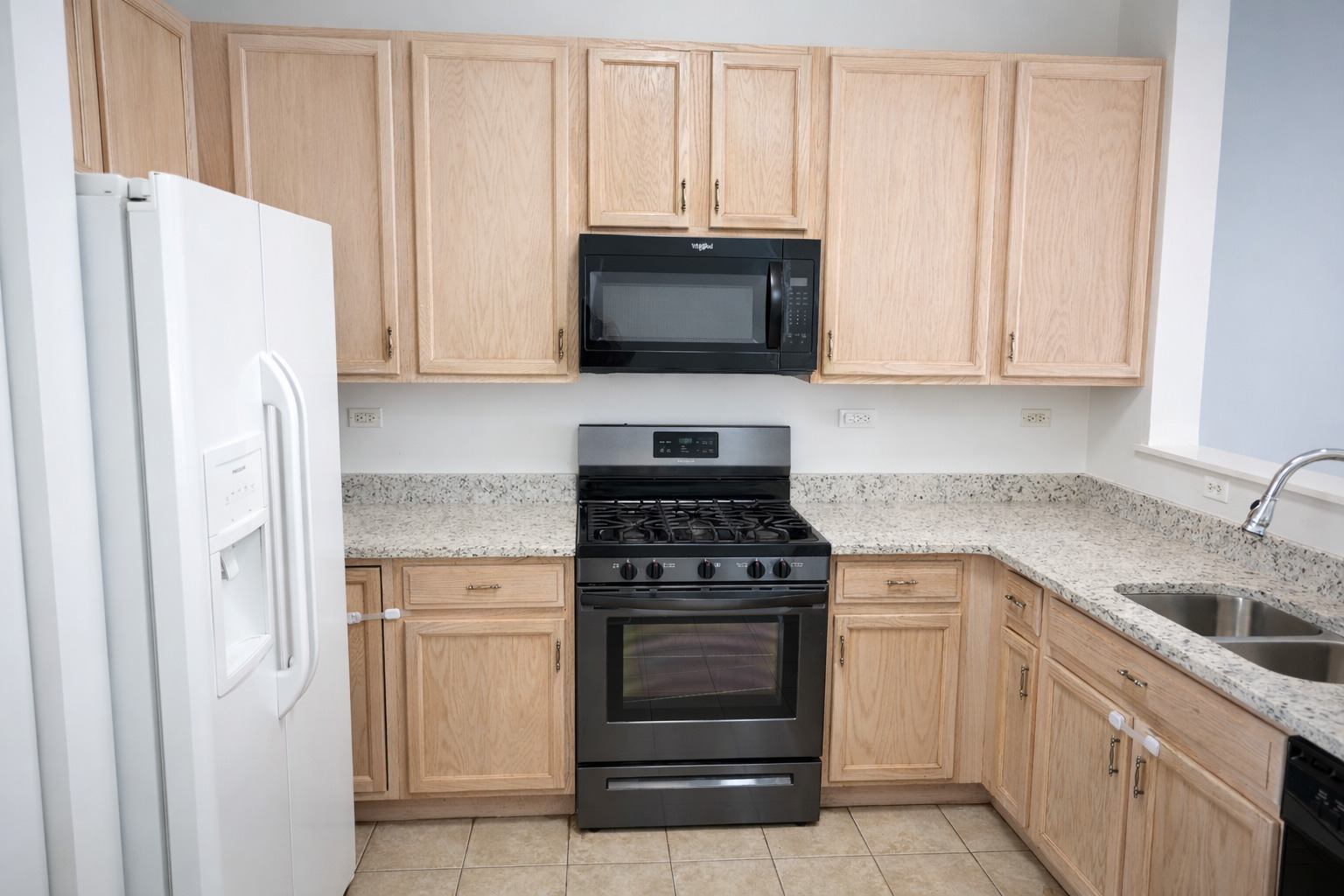 2441 Oneida Lane, Unit 2441 Naperville, IL 60563 - Photo 7 of 21 a kitchen with cabinets stainless steel appliances and a sink