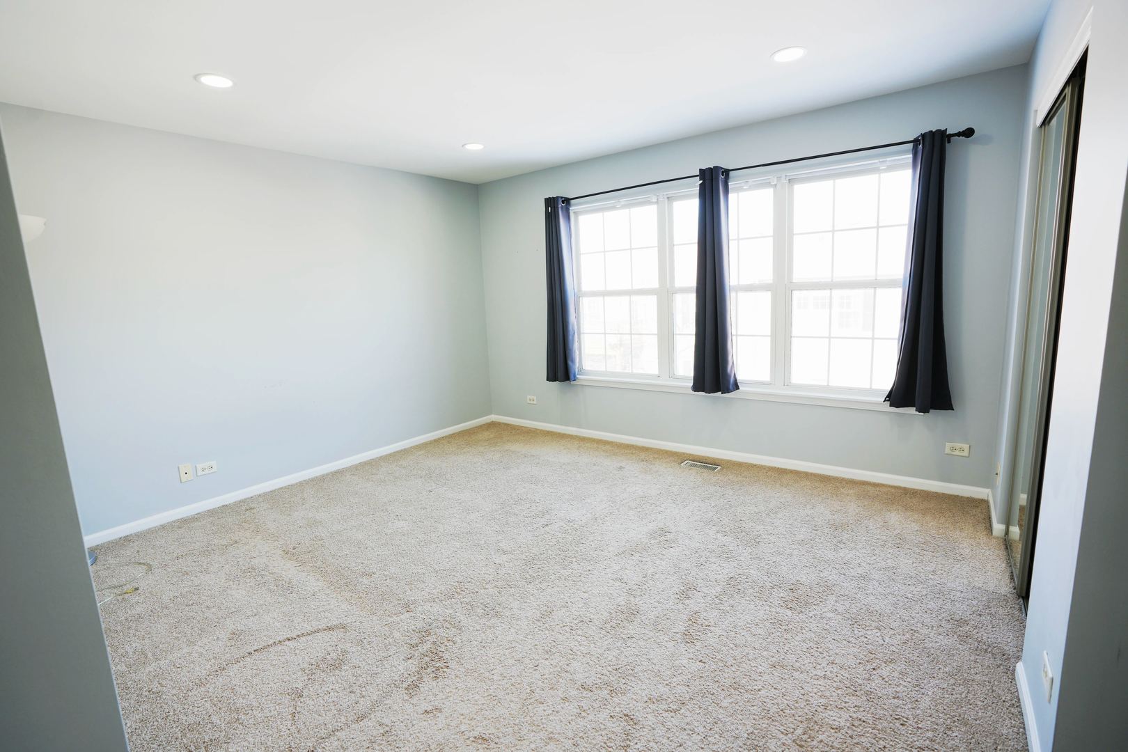2441 Oneida Lane, Unit 2441 Naperville, IL 60563 - Photo 10 of 21 an empty room with windows