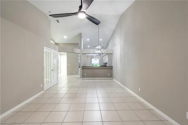 a view of a hallway and a kitchen