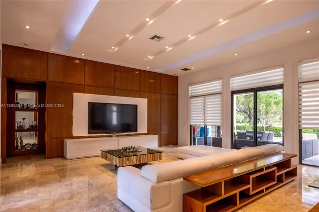 a view of a dining room with furniture and a window