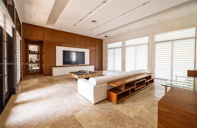 a dining room with furniture and windows