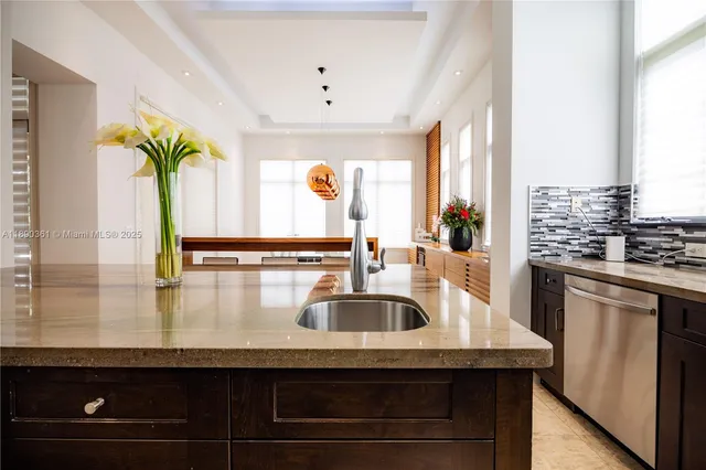 a bedroom with a bed and a night stand