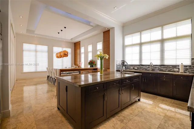 a bedroom with a bed couch and a window