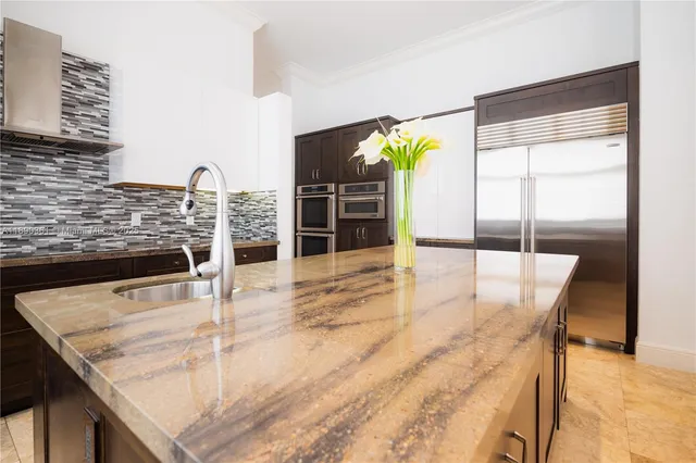 a bedroom with a large window and a bed