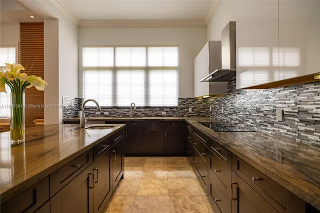 a white toilet sitting next to a white sink