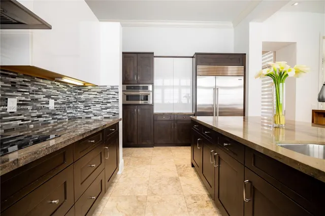 a bedroom with a bed and a television