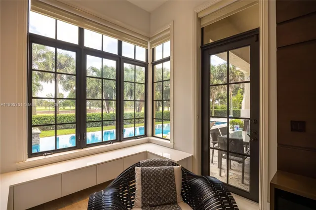 a view of hallway with closet and wooden floor