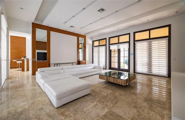 a spacious bedroom with a large bed and a couch