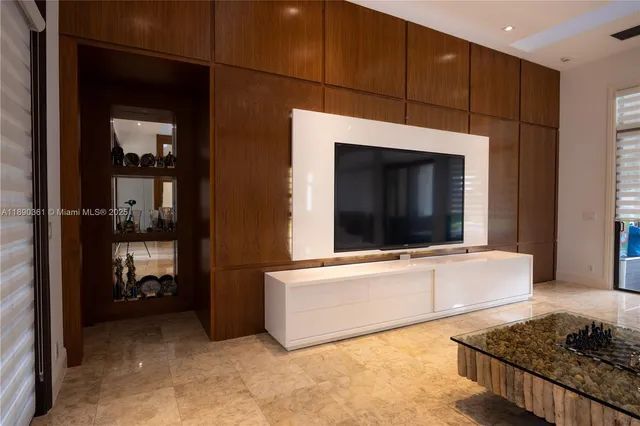 a living room with a flat screen tv