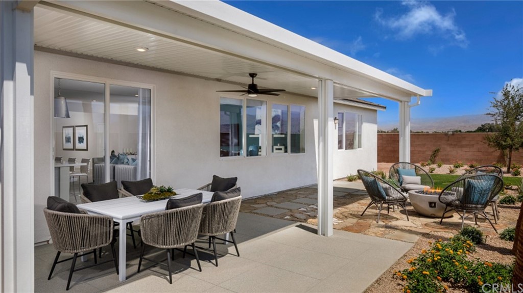 39614 Taffala Drive Indio, CA 92203 - Photo 11 of 14 a view of a patio with table and chairs and potted plants