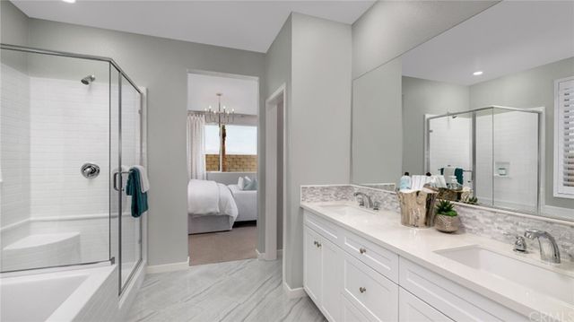 a bathroom with double vanity sink and mirror