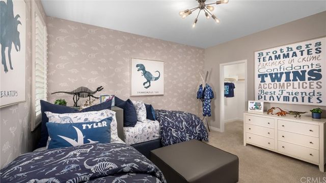 a bedroom with furniture and a window