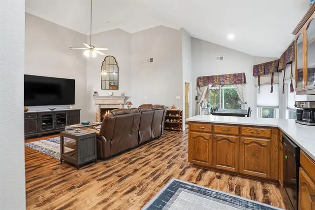 a kitchen with stainless steel appliances granite countertop a refrigerator and a stove
