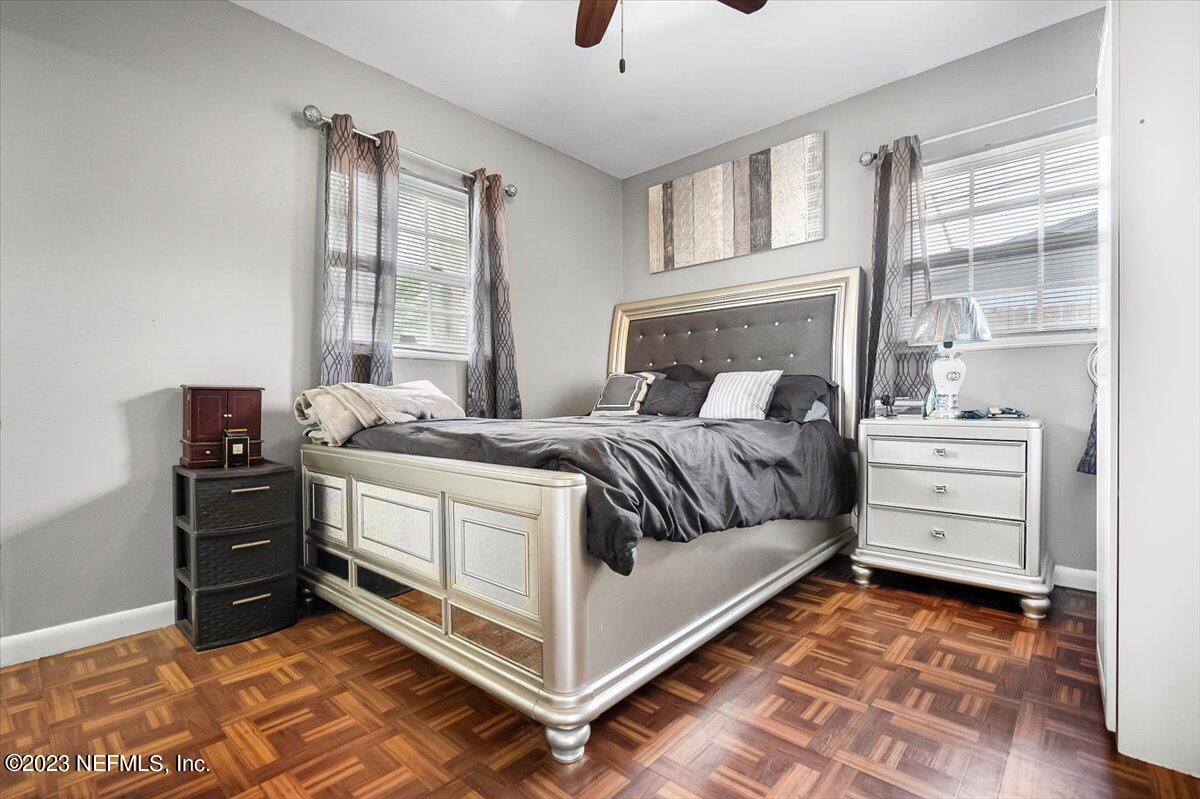 7240 Adele Court Jacksonville, FL 32277 - Photo 15 of 27 a bedroom with a bed and a window