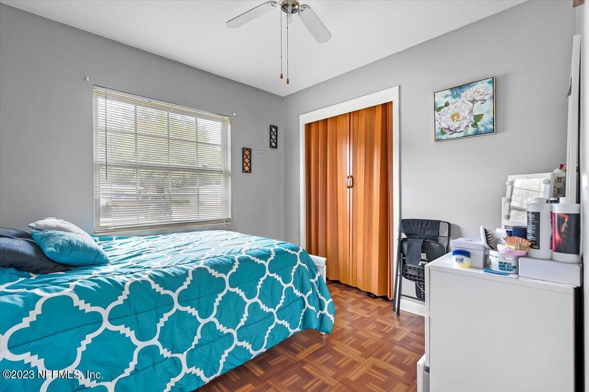 7240 Adele Court Jacksonville, FL 32277 - Photo 18 of 27 a bedroom with a bed and a window