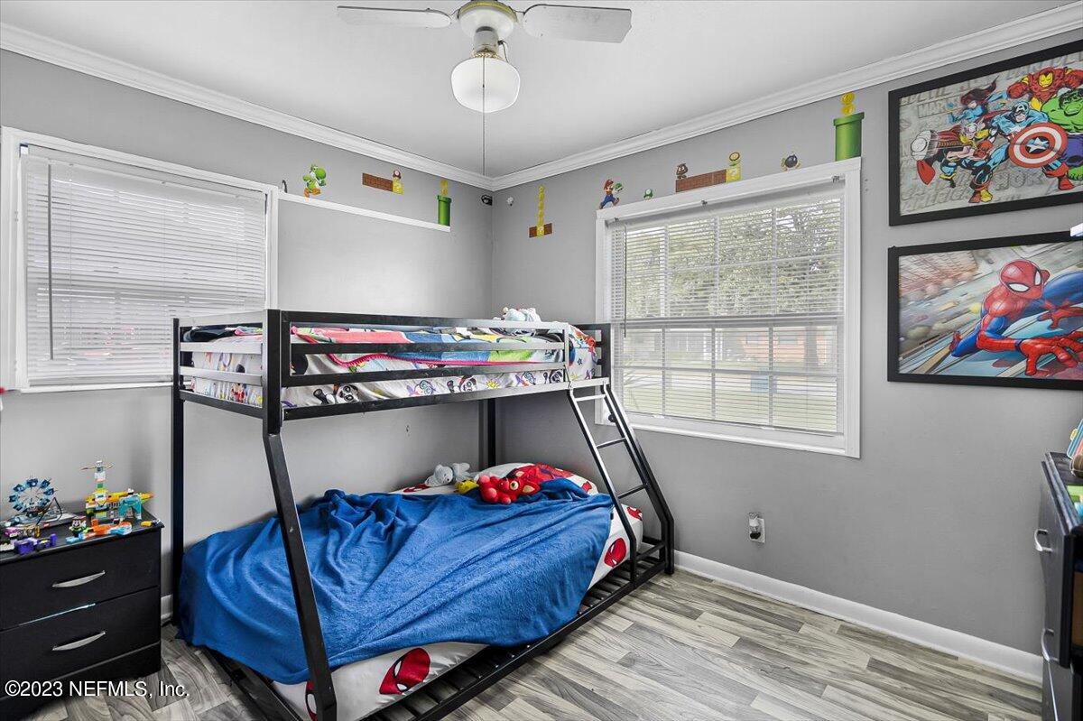 7240 Adele Court Jacksonville, FL 32277 - Photo 19 of 27 a bed room with a bed and a window