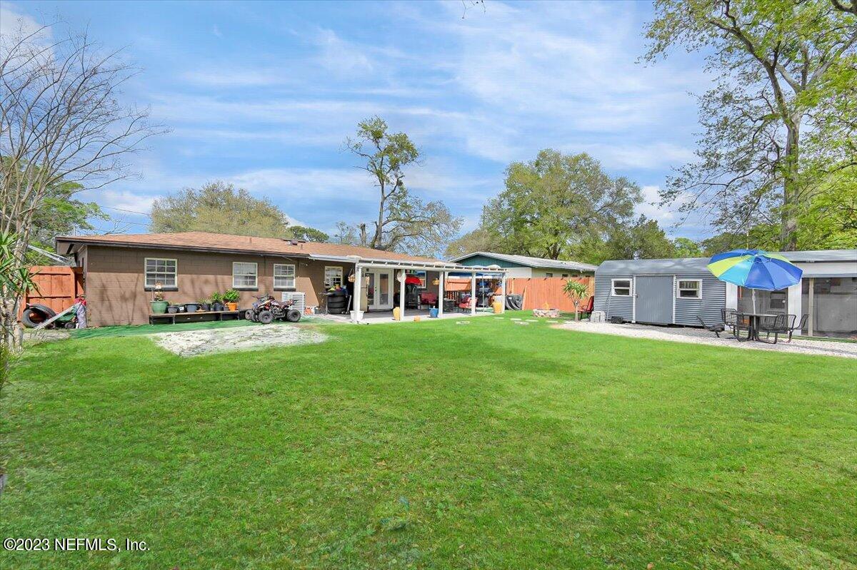 7240 Adele Court Jacksonville, FL 32277 - Photo 20 of 27 a front view of house with yard and seating area