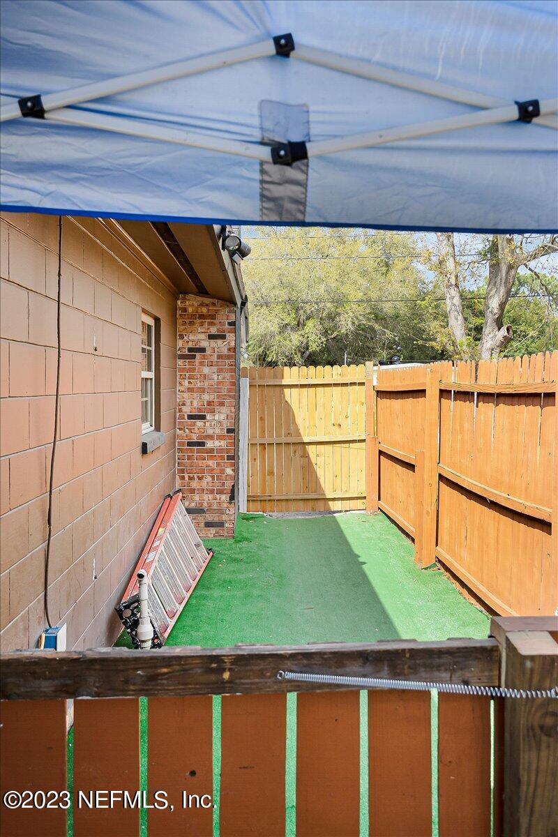 7240 Adele Court Jacksonville, FL 32277 - Photo 25 of 27 a view of a back yard on the house