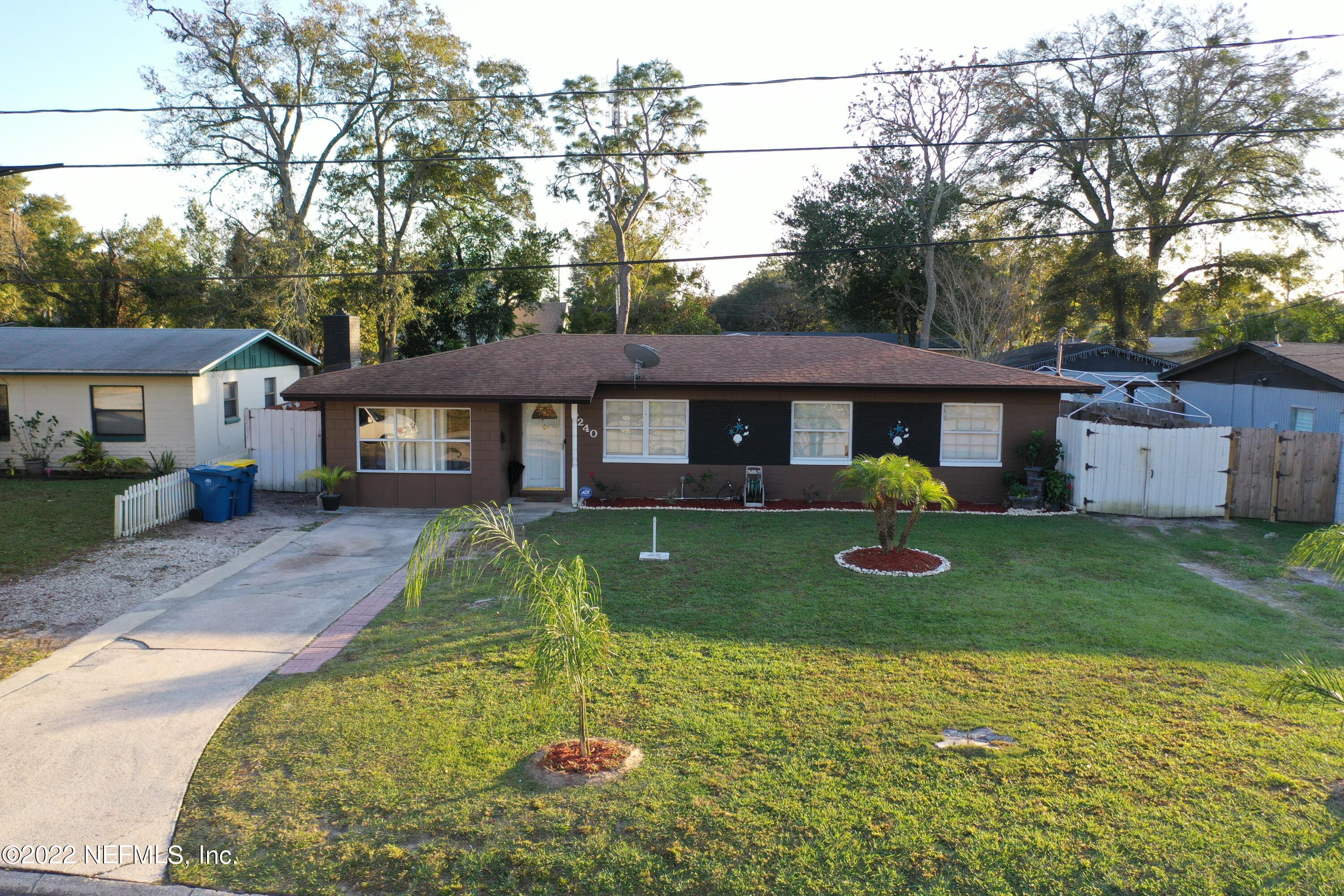 7240 Adele Court Jacksonville, FL 32277 - Photo 27 of 27 a front view of a house with a yard