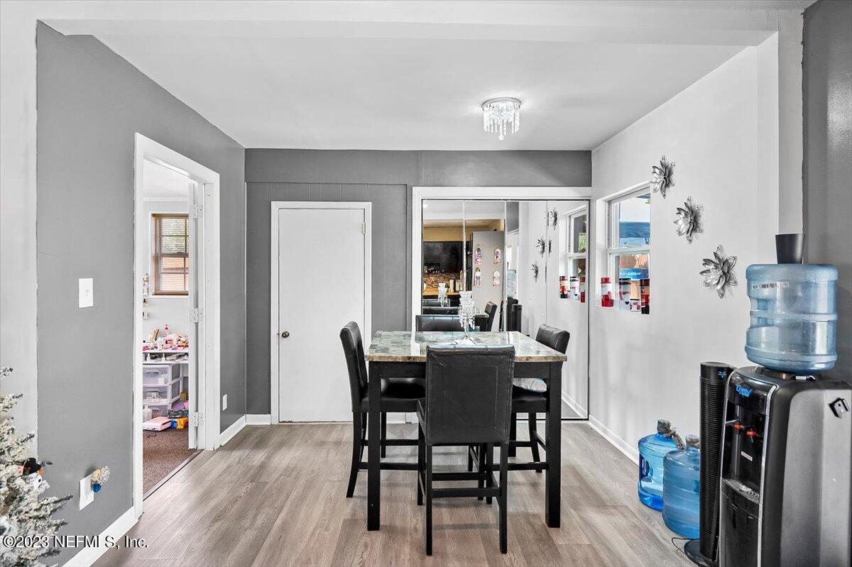 7240 Adele Court Jacksonville, FL 32277 - Photo 9 of 27 a view of a dining room with furniture and wooden floor