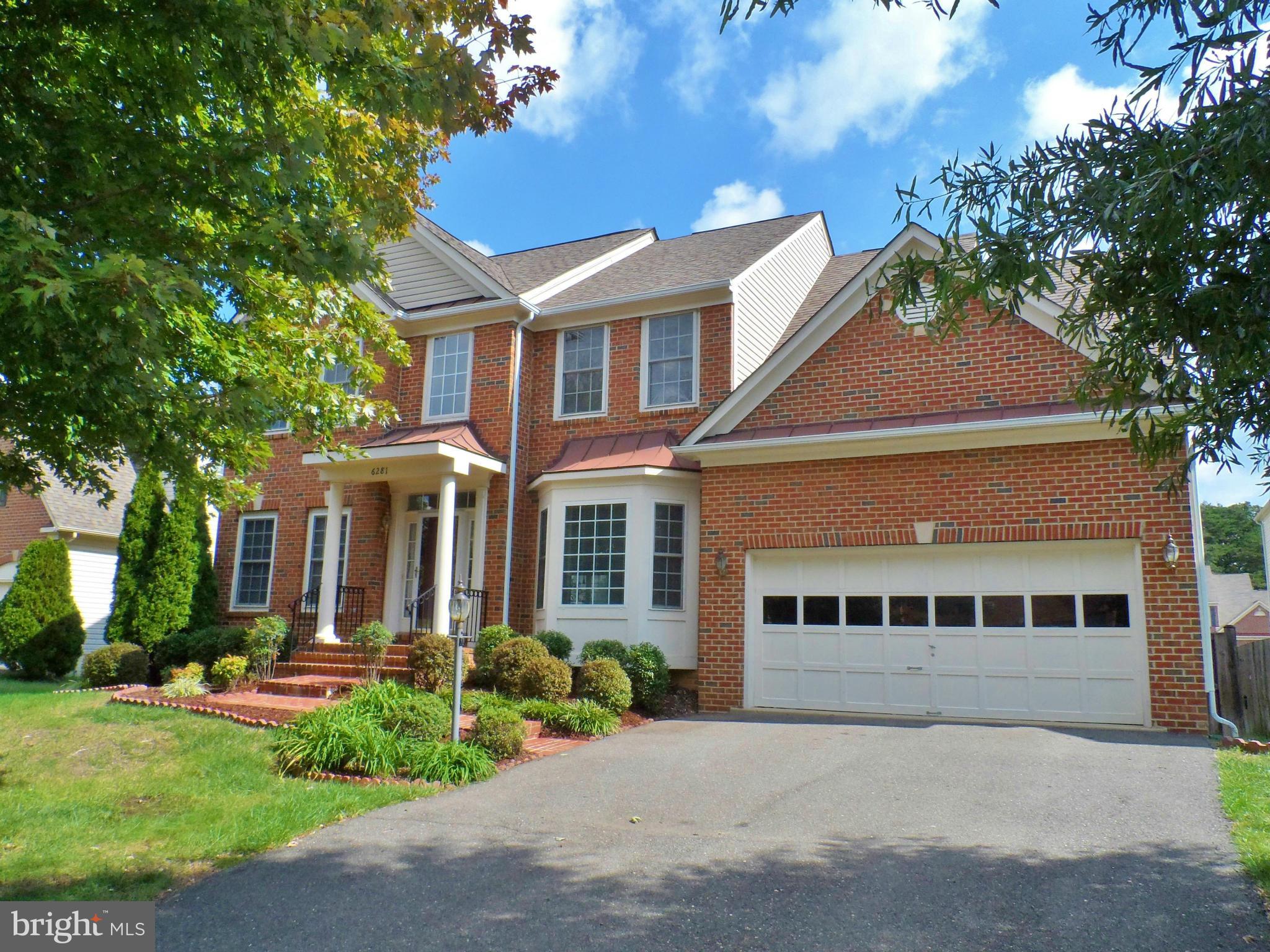 6281 Willowfield Way Springfield, VA 22150 - Photo 1 of 28 a front view of a house with a yard