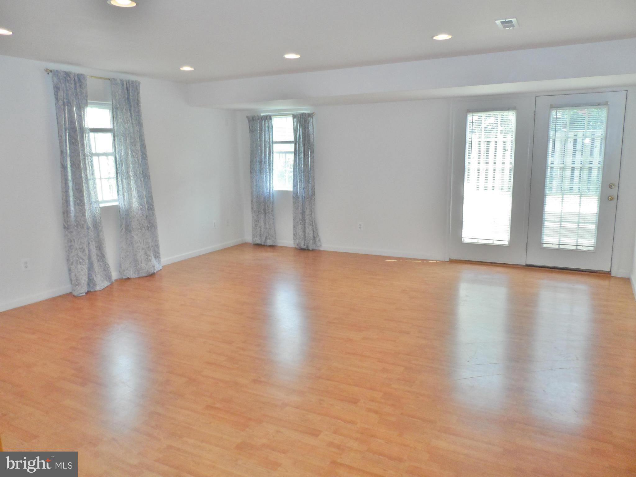 6281 Willowfield Way Springfield, VA 22150 - Photo 15 of 28 a view of empty room with wooden floor and fan