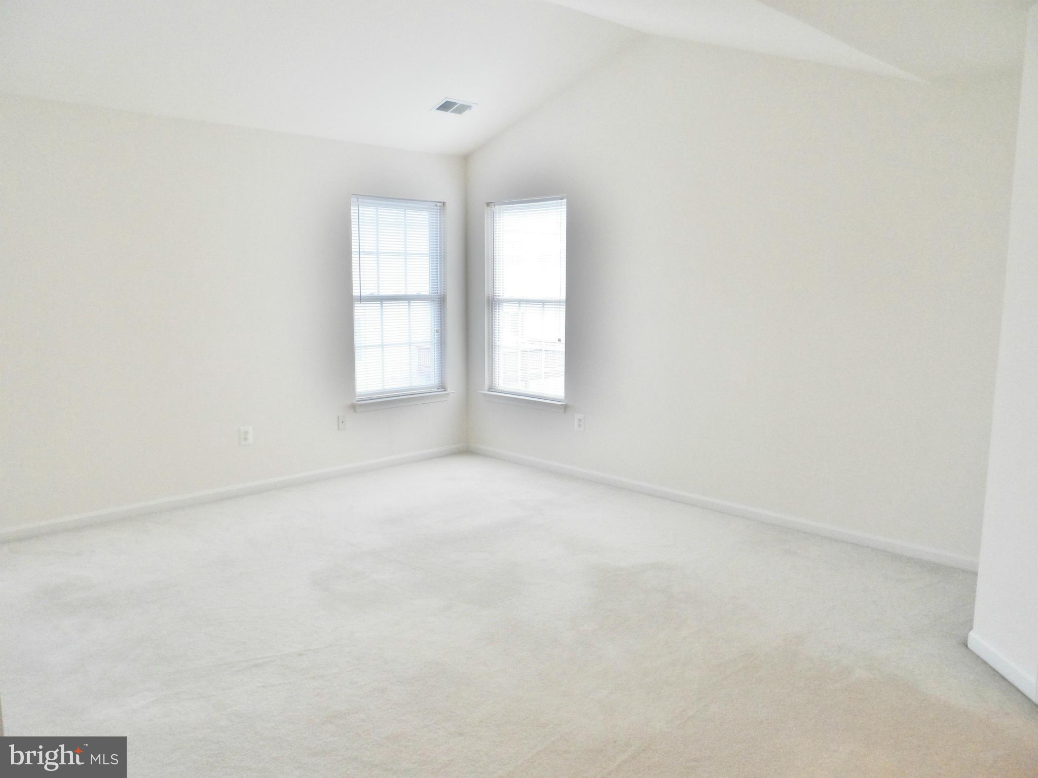 6281 Willowfield Way Springfield, VA 22150 - Photo 18 of 28 an empty room with windows and closet
