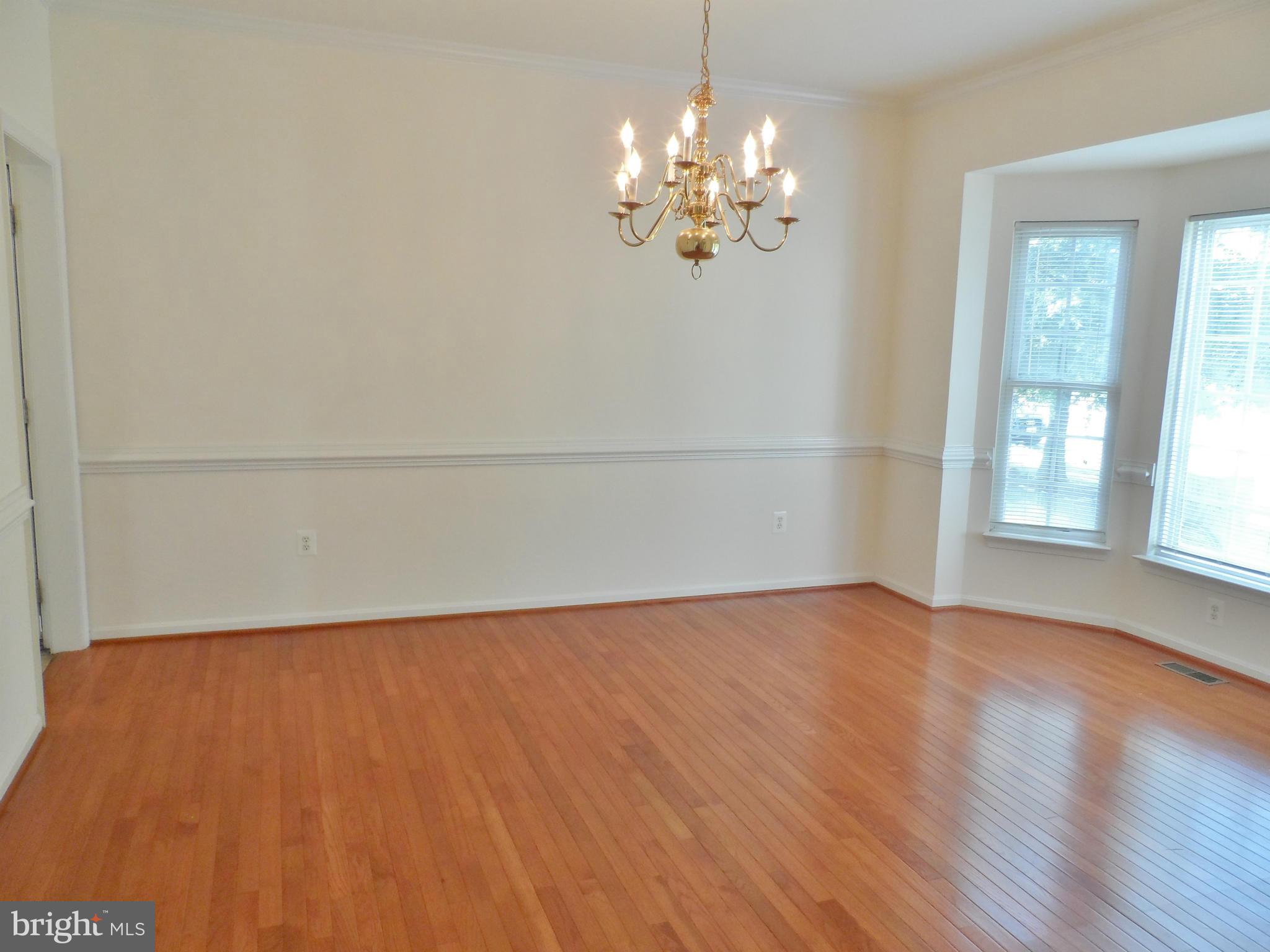 6281 Willowfield Way Springfield, VA 22150 - Photo 3 of 28 wooden floor in an empty room with a window