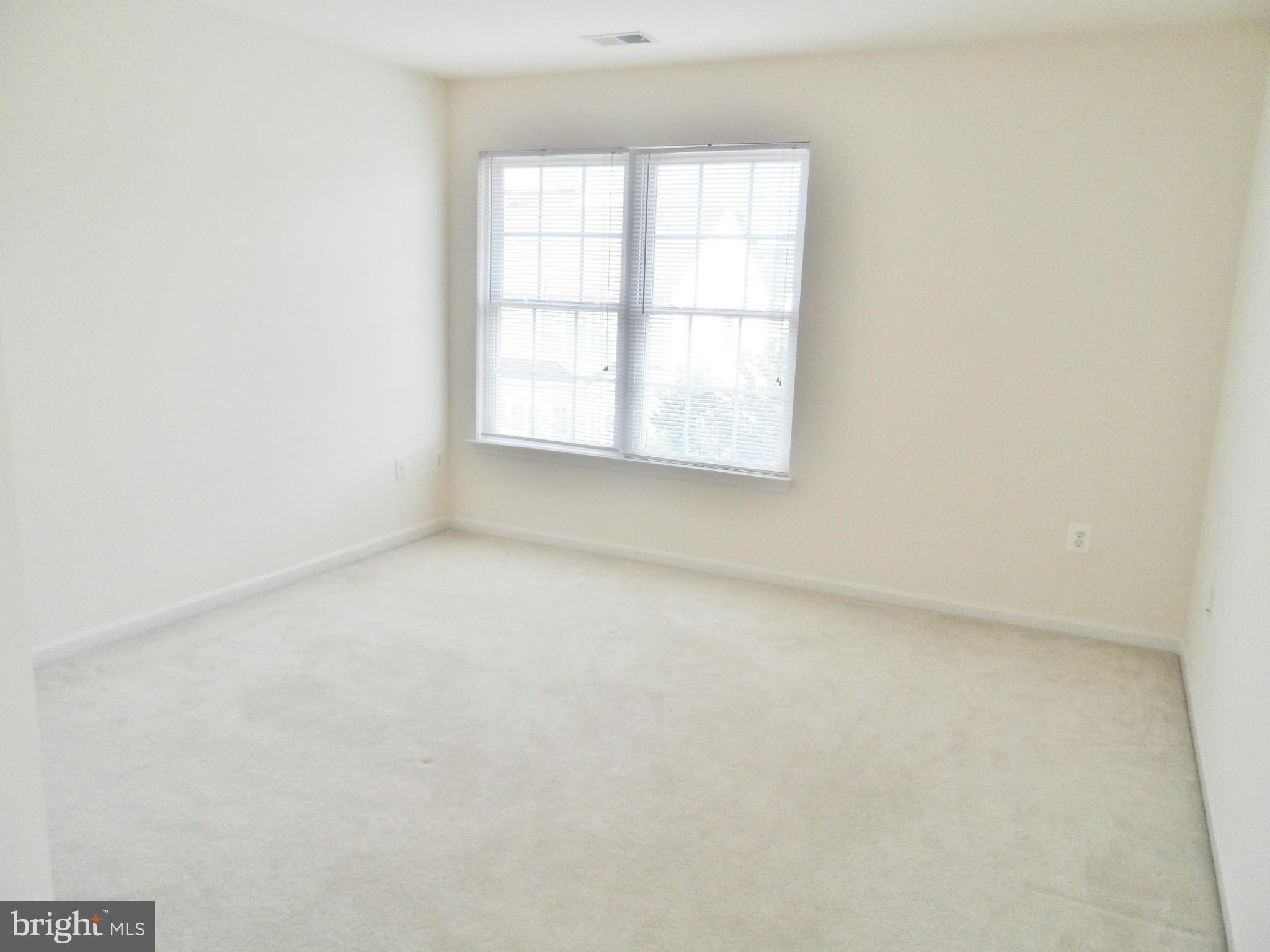 6281 Willowfield Way Springfield, VA 22150 - Photo 24 of 28 an empty room with a window