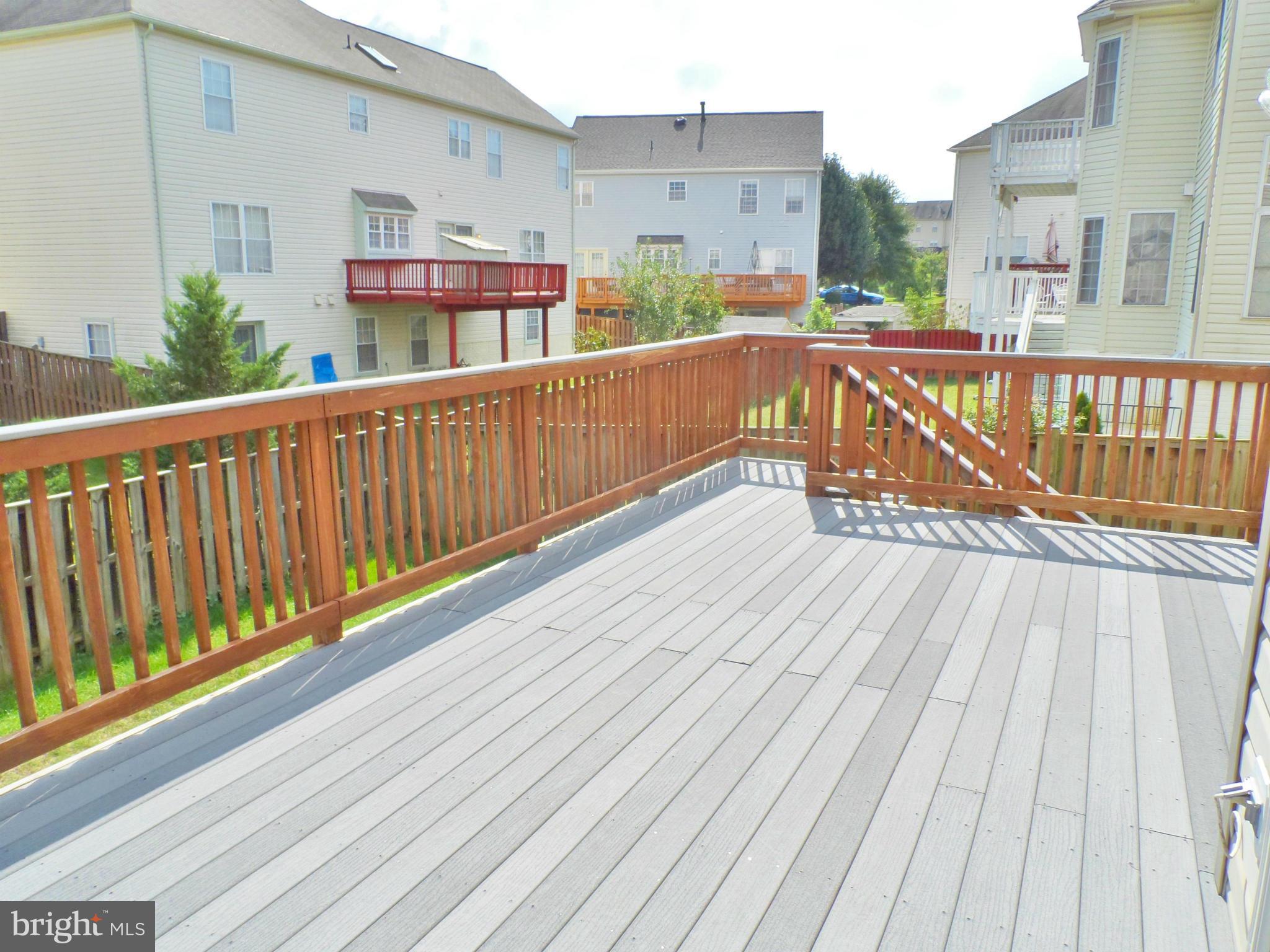 6281 Willowfield Way Springfield, VA 22150 - Photo 26 of 28 a view of a balcony with wooden floor