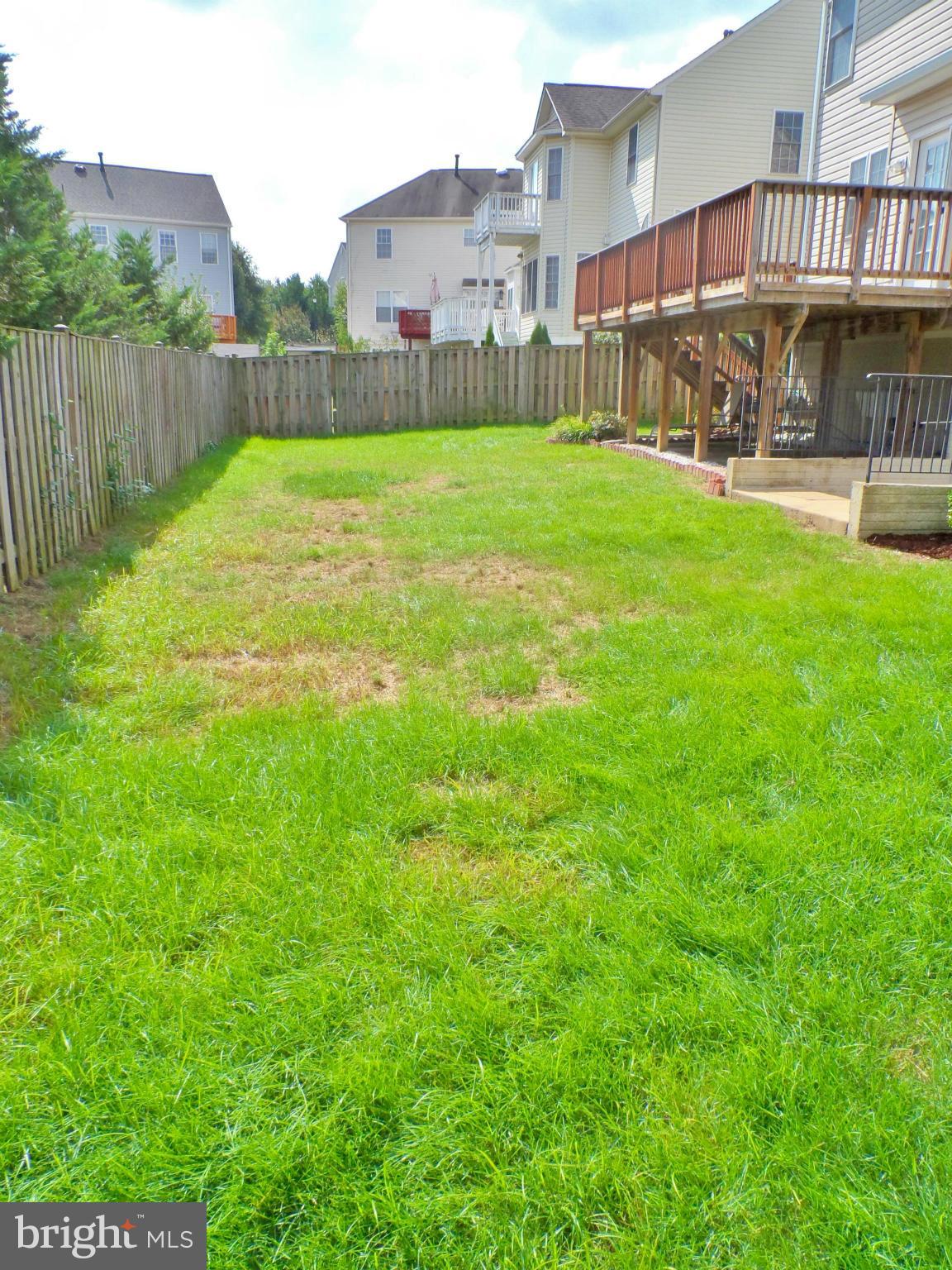6281 Willowfield Way Springfield, VA 22150 - Photo 28 of 28 a view of a big yard next to a house