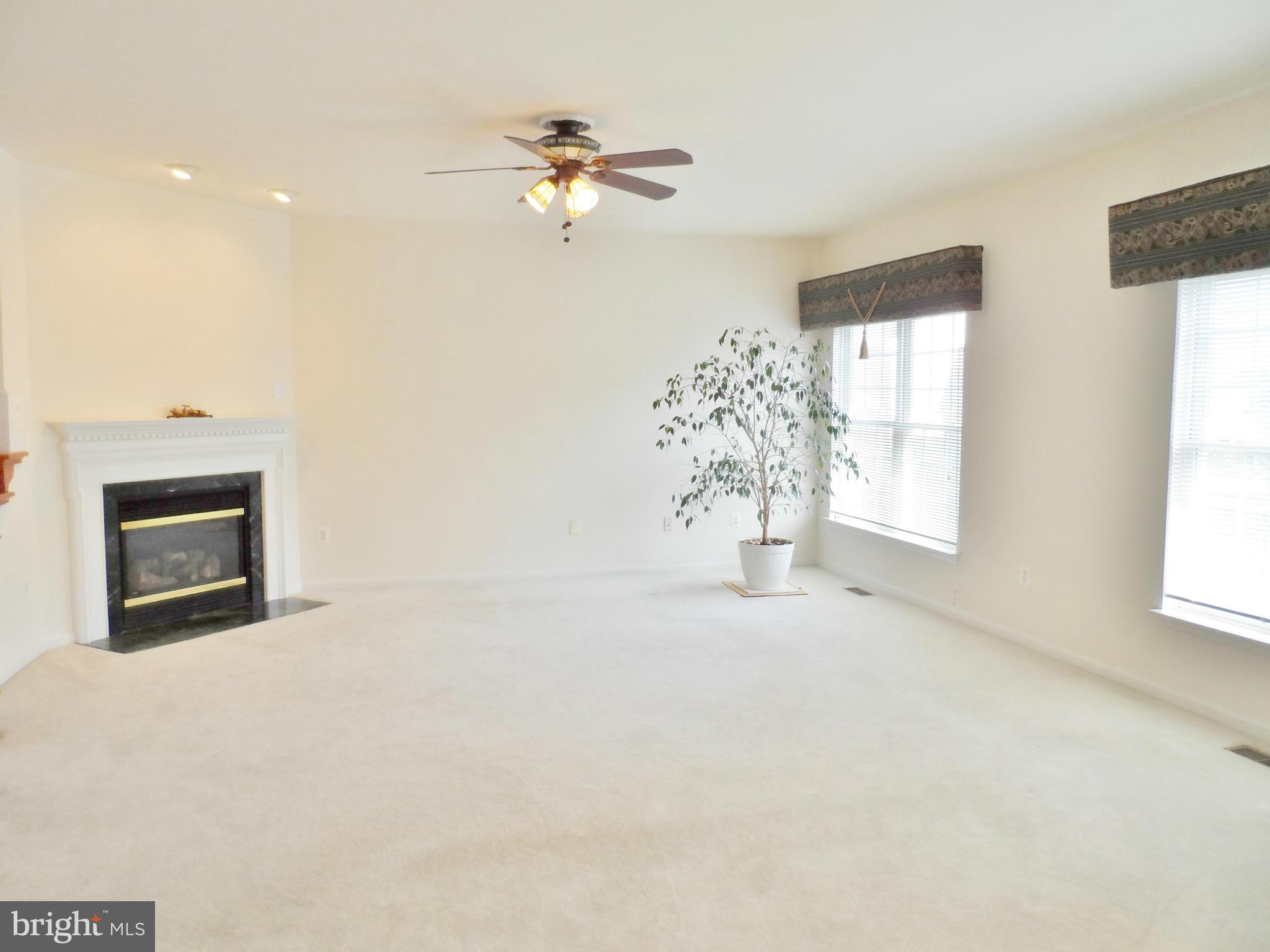 6281 Willowfield Way Springfield, VA 22150 - Photo 5 of 28 a view of livingroom with furniture and chandelier fan
