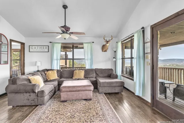 a living room with furniture and a large window