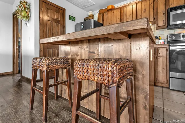 a view of a chairs and table in the balcony