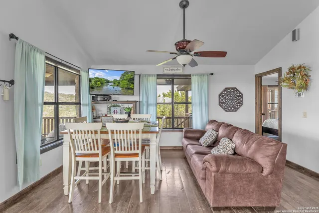 a view of a dining room with furniture window and outside view
