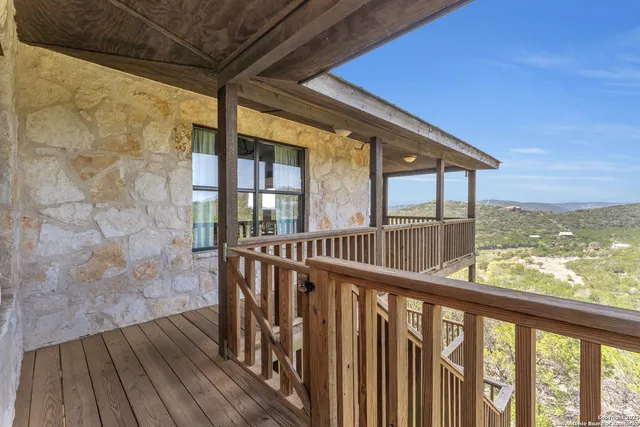 a view of balcony with wooden floor