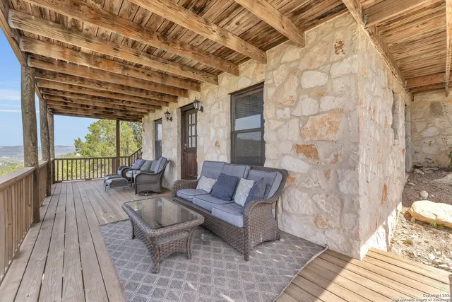 a outdoor living space with furniture and a rug