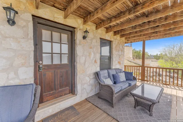 a living room with a couch and a potted plant