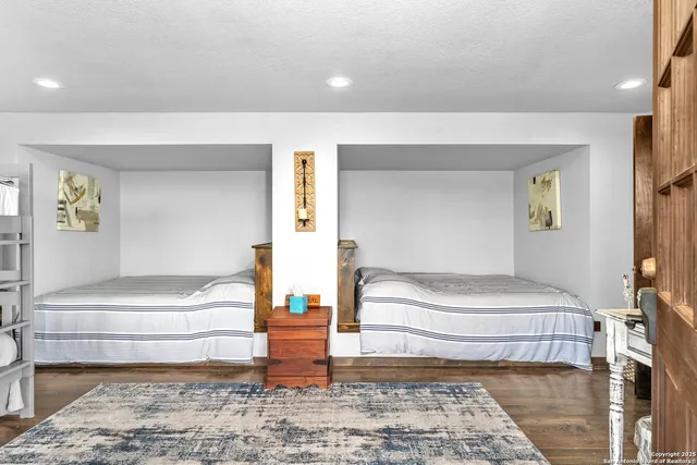 a bedroom with a large bed and a couch