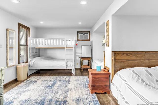a view of a hallway with a dining room and stairs