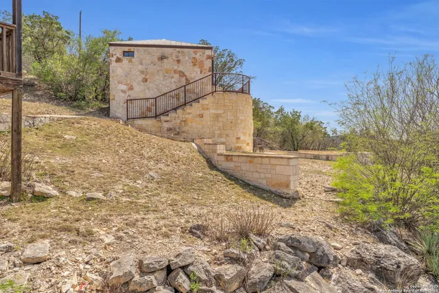 a spacious bedroom with a bed and a stove