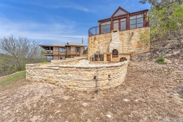 a view of a balcony with a potted plant